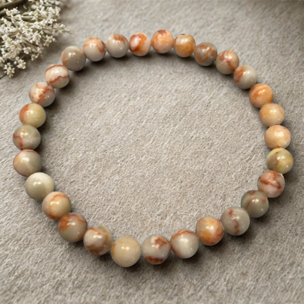 Pulsera de araña de sangre para fortalecer vínculos familiares y energías ancestrales desde el chakra raíz